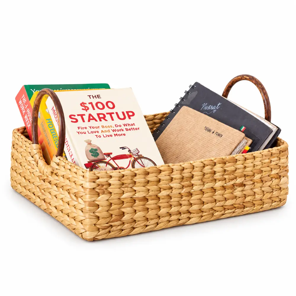 Kauna grass table organiser with cane handles holding books and notebooks