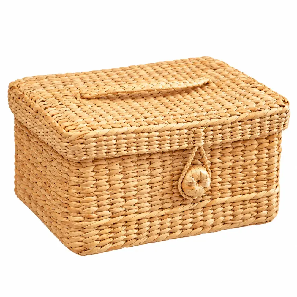 Handwoven kauna grass storage basket with lid, tan leather carry handle and woven loop-and-button closure